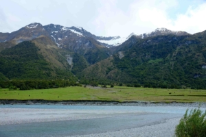 Pasture and high peaks in the Matukituki Valley Wild pastureland New Zealand